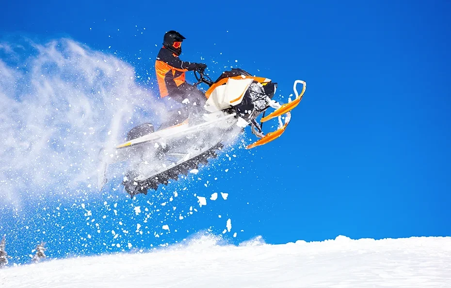 Person Riding a Snowmobile
